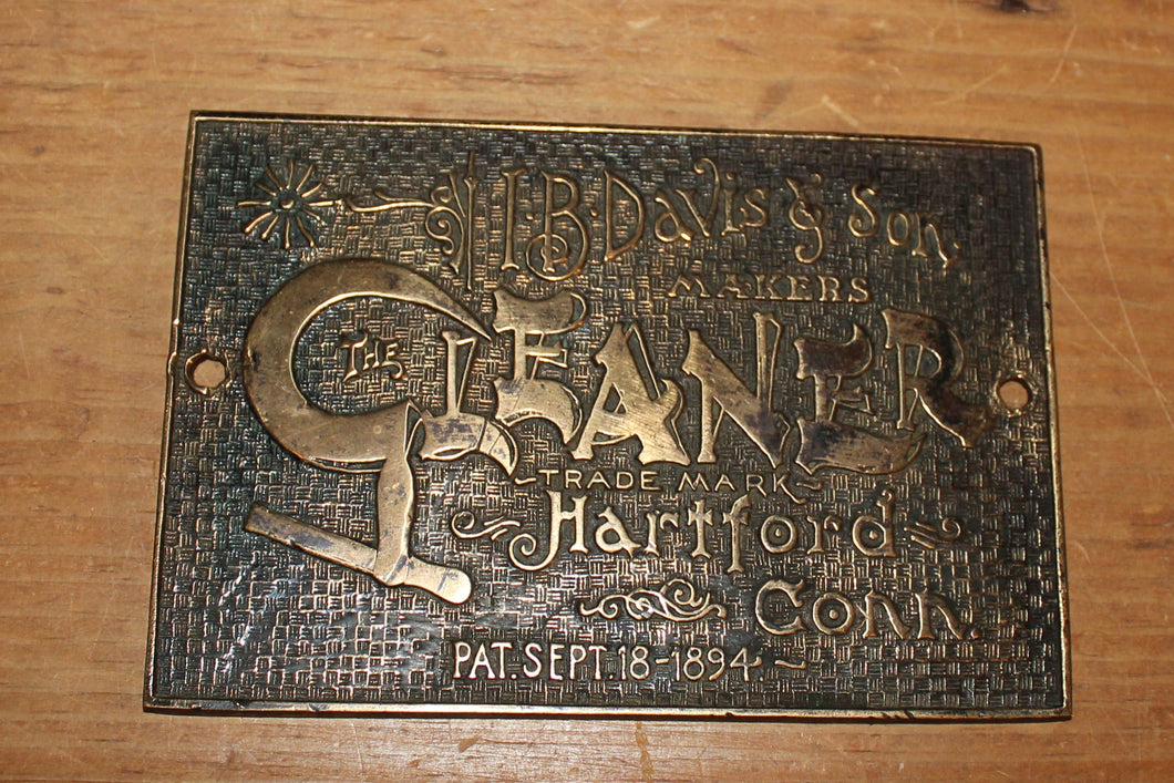 Brass company emblem for The Cleaner by I. B. Davis & Sons, Hartford, Conn