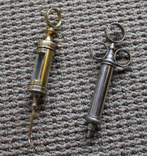 Load image into Gallery viewer, Two Antique Elegant Medical / Dental Syringes
