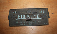 Load image into Gallery viewer, VINTAGE BUCKEYE INCUBATOR CO. CAST IRON COVER EMBOSSED SIGN No 119
